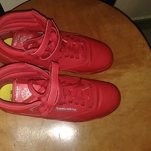 All red Reebok sneakers